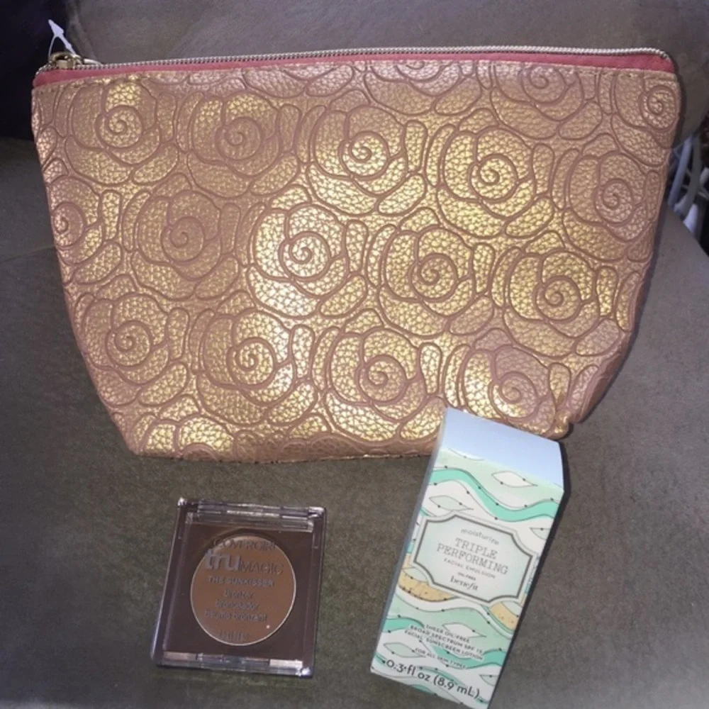 Makeup bag, sunscreen and Cover Girl bronzer